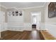 Hallway features built-in shelving, wainscoting, and hardwood floors at 1925 Banbury Rd, Raleigh, NC 27608