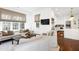 Sunlit living room with plush seating, designer window treatments, hardwood floors, and modern decor at 1925 Banbury Rd, Raleigh, NC 27608