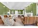 Well-lit living room offering plenty of seating space, a fireplace, and neutral-toned carpeting at 1925 Banbury Rd, Raleigh, NC 27608