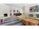This open-concept living room features a fireplace, a bar area, and a large sectional sofa at 1925 Banbury Rd, Raleigh, NC 27608