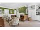 Spacious living room featuring a fireplace, built-in bookshelves, and comfortable seating arrangement at 1925 Banbury Rd, Raleigh, NC 27608