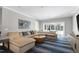 The living room features a large sectional sofa, hardwood floors, and plenty of natural light at 1925 Banbury Rd, Raleigh, NC 27608