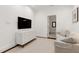 Cozy living area with neutral tones, recessed lighting, and wood floors at 1925 Banbury Rd, Raleigh, NC 27608