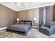 Spacious main bedroom with plush carpeting, decorative lighting, and designer window treatments at 1925 Banbury Rd, Raleigh, NC 27608