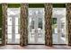Bright patio doors with elegant curtains leading to the outdoor area at 1925 Banbury Rd, Raleigh, NC 27608