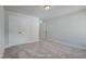 A neutral bedroom featuring a closet and a doorway showcasing the home's layout at 195 Duncan Creek Rd # 123, Lillington, NC 27546