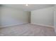 Neutral bedroom boasts plush carpeting and ample space for furniture arrangement at 195 Duncan Creek Rd # 123, Lillington, NC 27546