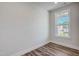 Bright bedroom with natural light, showcasing wood-look flooring and neutral walls at 195 Duncan Creek Rd # 123, Lillington, NC 27546
