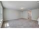 Large, carpeted bonus room with neutral walls, multiple windows, and a light ceiling fixture at 195 Duncan Creek Rd # 123, Lillington, NC 27546