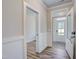 Inviting home foyer showcasing wood-look floors, trim, and a view of the front door at 195 Duncan Creek Rd # 123, Lillington, NC 27546