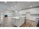 Open kitchen with a large island, modern stainless steel appliances, and white cabinetry at 195 Duncan Creek Rd # 123, Lillington, NC 27546