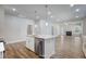 Bright, open kitchen featuring a large island, stainless steel appliances, and ample natural light at 195 Duncan Creek Rd # 123, Lillington, NC 27546