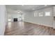 Open-concept living area featuring a fireplace, wood floors, and multiple windows for natural light at 195 Duncan Creek Rd # 123, Lillington, NC 27546