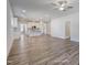 Expansive open-concept living space with hardwood floors, a kitchen, and natural lighting at 195 Duncan Creek Rd # 123, Lillington, NC 27546