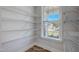 Walk-in pantry with wire shelving and a window at 195 Duncan Creek Rd # 123, Lillington, NC 27546