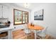 Dining area featuring a wood table and wood-framed window with views of the outdoors at 2 Edgestone Pl, Chapel Hill, NC 27517