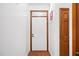 Bright foyer featuring a white front door and a hardwood floor at 2 Edgestone Pl, Chapel Hill, NC 27517