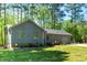 Charming home exterior with a gray facade, well-manicured lawn, and a two-car garage at 2 Edgestone Pl, Chapel Hill, NC 27517