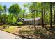 Charming single-story home with a well-maintained lawn and mature trees at 2 Edgestone Pl, Chapel Hill, NC 27517