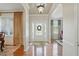 Inviting foyer with hardwood floors, white trim, and views of the formal living area at 2006 Prairie Ridge Ct, Fuquay Varina, NC 27526