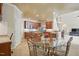 Spacious open-concept kitchen and breakfast nook with stainless steel appliances and tiled floors at 2006 Prairie Ridge Ct, Fuquay Varina, NC 27526