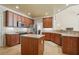 A well-equipped kitchen with stainless steel appliances, ample counter space, and a functional center island at 2006 Prairie Ridge Ct, Fuquay Varina, NC 27526