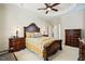 Spacious bedroom with detailed furnishings, tray ceiling and carpeted flooring at 2006 Prairie Ridge Ct, Fuquay Varina, NC 27526
