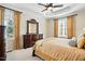 Serene main bedroom featuring tray ceilings, carpet, and two windows with beautiful window coverings at 2006 Prairie Ridge Ct, Fuquay Varina, NC 27526