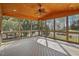 Relaxing screened porch with a wooden ceiling, ceiling fan, and views of the backyard at 2006 Prairie Ridge Ct, Fuquay Varina, NC 27526