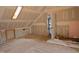 Unfinished attic with a skylight, framed doorway, and rough-in electrical at 2121 Allensville Rd, Roxboro, NC 27574