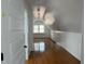 Bright attic featuring hardwood floors, ample natural light from a window, and white walls at 2121 Allensville Rd, Roxboro, NC 27574