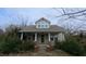 Charming home featuring a covered front porch and beautiful architectural details at 2121 Allensville Rd, Roxboro, NC 27574