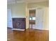 Inviting living room with hardwood floors, a decorative fireplace, and a doorway to another room at 2121 Allensville Rd, Roxboro, NC 27574