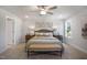 Bright bedroom featuring neutral walls, patterned bedside tables, and decorative art above the bed at 217 Duncan Creek Rd # 124, Lillington, NC 27546