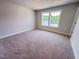 Bright bedroom with carpet floors, neutral walls, and a double window offering views at 217 Duncan Creek Rd # 124, Lillington, NC 27546