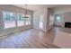 Bright dining area with wood-style floors, modern lighting, and access to the outdoor living space at 217 Duncan Creek Rd # 124, Lillington, NC 27546