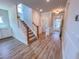 Open entryway features wood-look floors, staircase, and access to various rooms at 217 Duncan Creek Rd # 124, Lillington, NC 27546