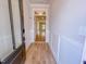 View of entryway with wood-look flooring and decorative molding leading into open living space at 217 Duncan Creek Rd # 124, Lillington, NC 27546