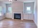 Cozy living room features a fireplace with built-in cabinets, and wood-look flooring at 217 Duncan Creek Rd # 124, Lillington, NC 27546