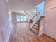 Bright living room featuring hardwood floors, a ceiling fan, and large windows at 217 Duncan Creek Rd # 124, Lillington, NC 27546