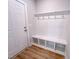 Functional mudroom with built-in bench seating, storage cubbies, and hooks for coats, providing an organized transition space at 217 Duncan Creek Rd # 124, Lillington, NC 27546