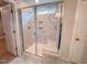 Bathroom showcases a modern glass shower with white marble-style tile and a built-in bench at 217 Duncan Creek Rd # 124, Lillington, NC 27546
