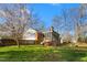 Exterior view of home featuring a screened porch and fenced backyard at 2203 Canterbury Dr, Burlington, NC 27215