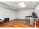 Unfurnished basement with hardwood floors and white paneled walls at 2203 Canterbury Dr, Burlington, NC 27215