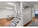 Basement stairs with carpet and a ping pong table in the background at 2203 Canterbury Dr, Burlington, NC 27215