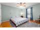 Cozy bedroom with hardwood floors, natural light, and comfortable furnishings at 2203 Canterbury Dr, Burlington, NC 27215