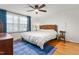 A bedroom with a large window and a wicker headboard at 2203 Canterbury Dr, Burlington, NC 27215