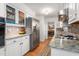 Kitchen showcasing white cabinets, granite countertops, and stainless steel appliances at 2203 Canterbury Dr, Burlington, NC 27215