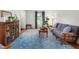 Bright living room featuring hardwood floors, a large rug, and ample natural light at 2203 Canterbury Dr, Burlington, NC 27215