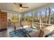 Screened porch with furniture, a ceiling fan, and views of the backyard at 2203 Canterbury Dr, Burlington, NC 27215